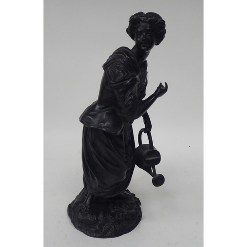 249 - E Blavier - a black painted bronze figure, a young woman holding a watering can, standing on a natur... 