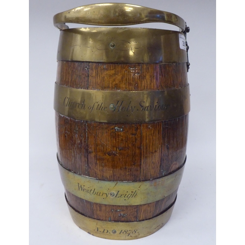 250 - A late 19thC coopered oak and brass bound bucket with a swing handle  bears the engraved legend... 