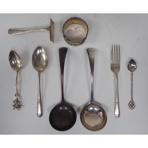 253 - Silver collectables: to include a pair of Old English pattern sauce ladles; and a napkin ring  ... 