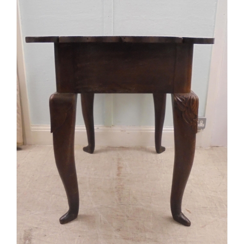 255 - An early 18thC possibly Irish oak lowboy, the planked top with a shaped border and apron, incorporat... 