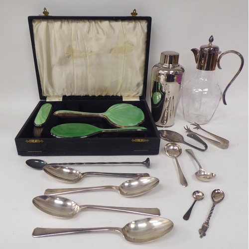 262 - Silver plated tableware: to include an Alfra cocktail shaker; flatware; and a three piece, enamelled... 