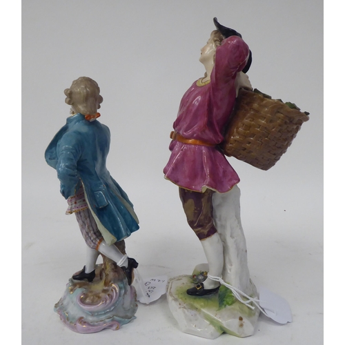 263 - Two Continental porcelain figures, a girl wearing a puce coloured tunic, carrying a basket of fruit ... 