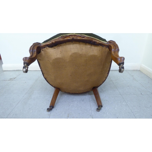 48 - A mid 19thC walnut framed salon chair with a button upholstered green fabric back, raised on cabriol... 