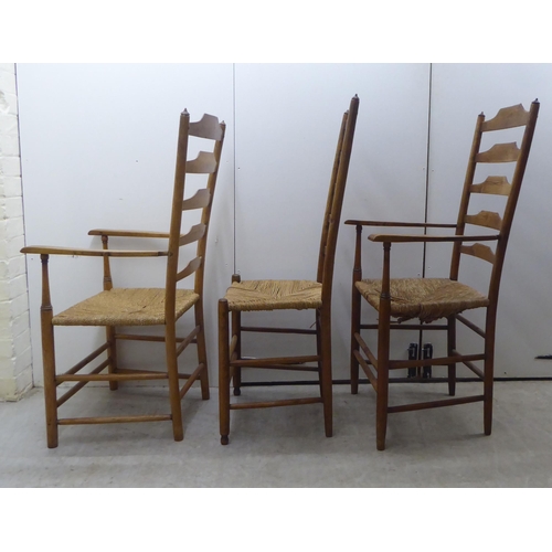 51 - A set of seven 19thC country made oak framed ladderback dining chairs with woven string seats, raise... 