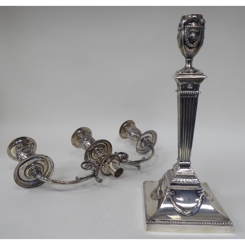 64 - An Edwardian loaded silver two part table candelabrum of Neo Classical design, comprising three vase... 