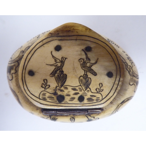 68 - An 18thC, possibly Dutch, scratch engraved bone, oval, cushion shape snuff box with a hinged lid, fe... 