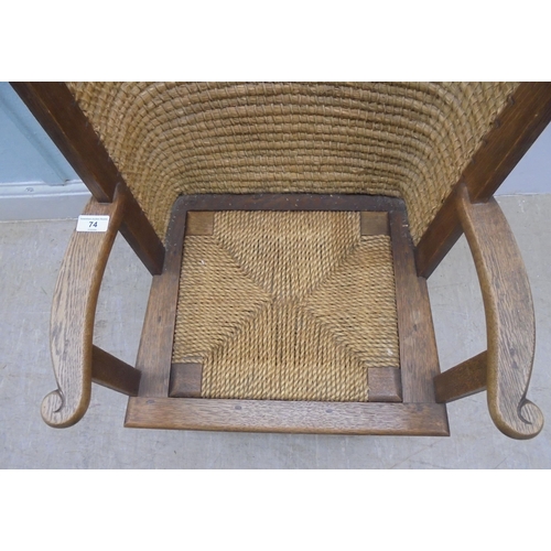 74 - A child's oak framed Orkney chair with a drop-in, woven string seat