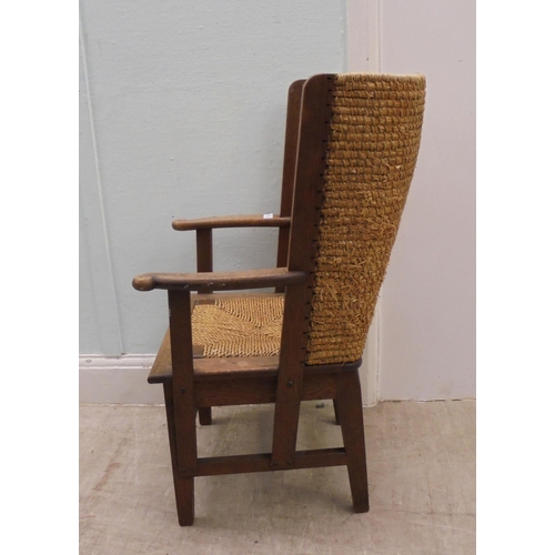 74 - A child's oak framed Orkney chair with a drop-in, woven string seat