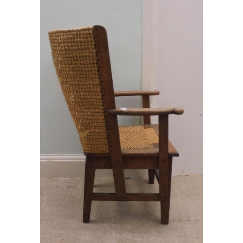 74 - A child's oak framed Orkney chair with a drop-in, woven string seat