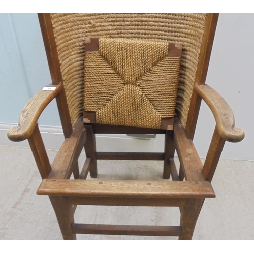 74 - A child's oak framed Orkney chair with a drop-in, woven string seat