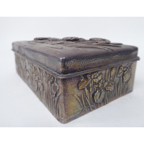 90 - An early 20thC Chinese silver coloured metal clad, hardwood cigarette box, embossed in Sino-European... 