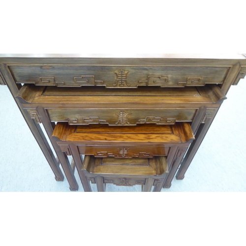 92 - Modern Chinese altar design carved teak quartetto tables, raised on moulded square legs  largest 27