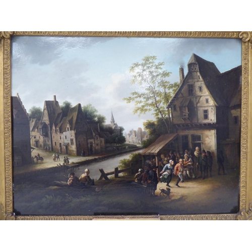 96 - In the manner of David Teniers the younger - a small gathering by a canal and town buildings beyond ... 