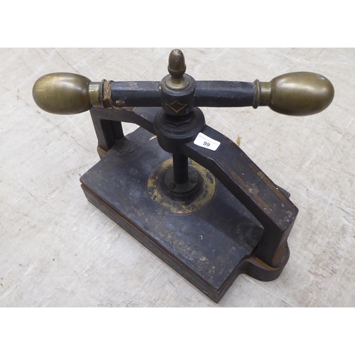 99 - A late 19thC cast iron bookpress with gilt ornament  19