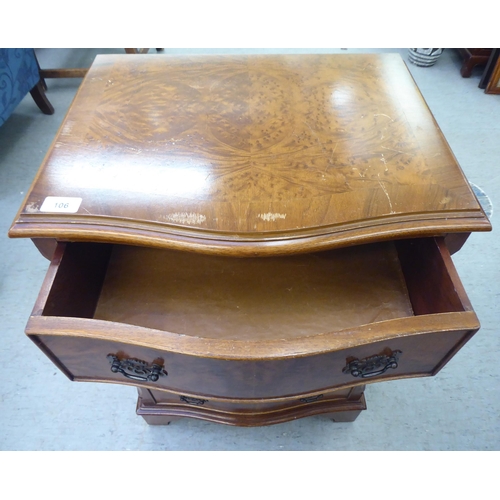 106 - A modern serpentine front walnut finished four drawer tallboy, raised on bracket feet  31