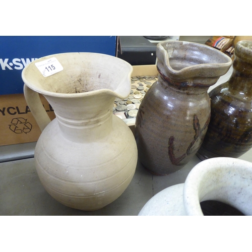 115 - Studio pottery: to include vases and jugs  various sizes, colours and designs