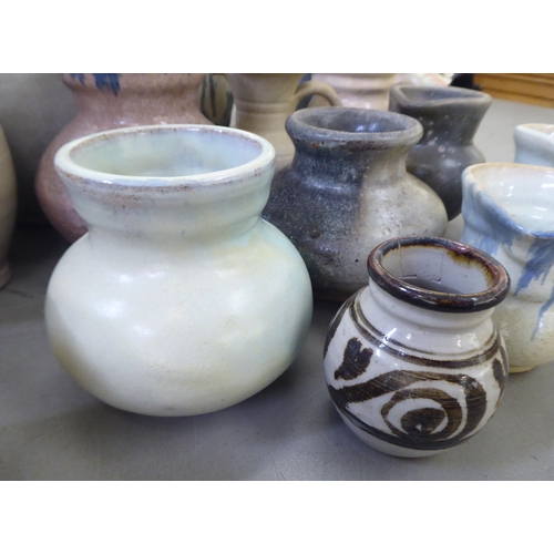 115 - Studio pottery: to include vases and jugs  various sizes, colours and designs