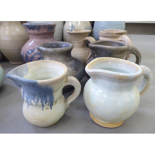 115 - Studio pottery: to include vases and jugs  various sizes, colours and designs