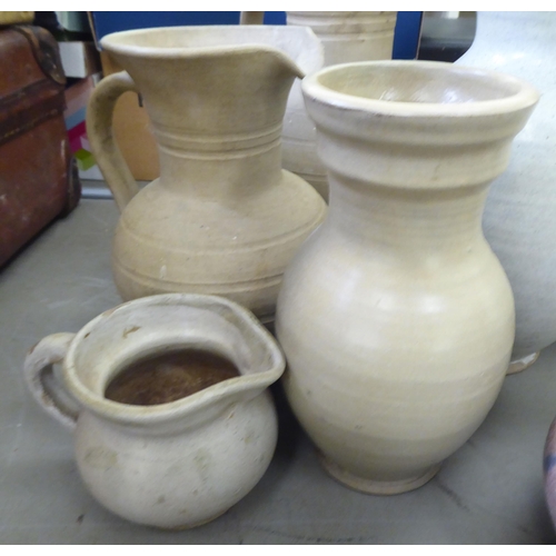 115 - Studio pottery: to include vases and jugs  various sizes, colours and designs