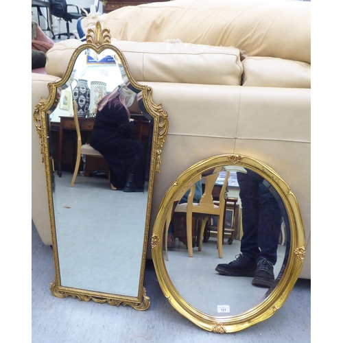 121 - Two dissimilar bevelled glass mirrors, in gilt frames  21