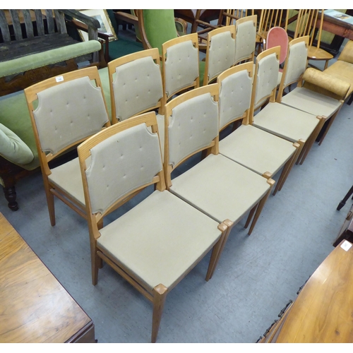 148 - A set of ten modern designer light oak framed dining chairs chairs with square backs, part button up... 