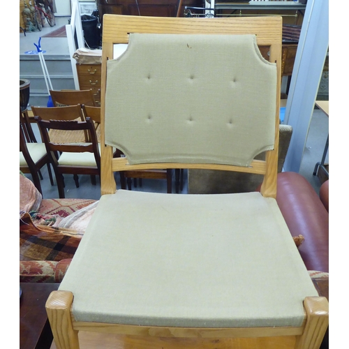 148 - A set of ten modern designer light oak framed dining chairs chairs with square backs, part button up... 