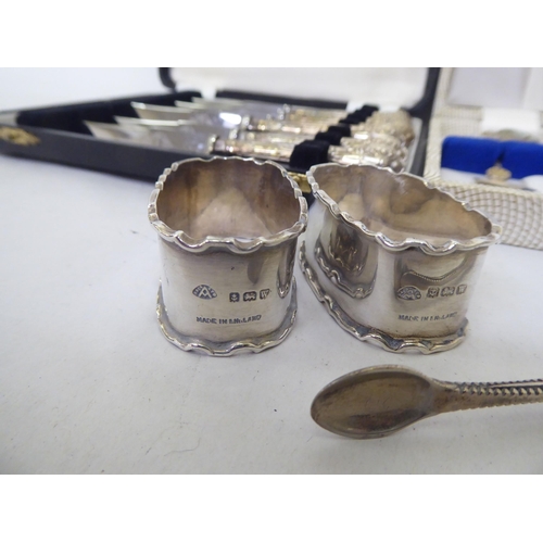 149 - Silver and white metal collectables and flatware: to include napkin rings  mixed marks