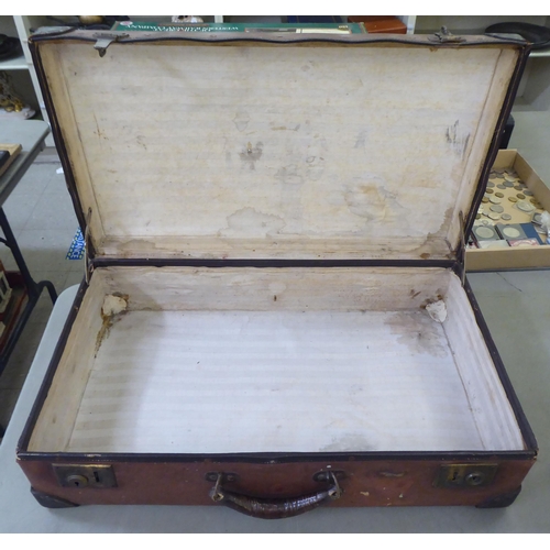 152 - Four items of 20thC luggage: to include a brown hide doctor's style bag 