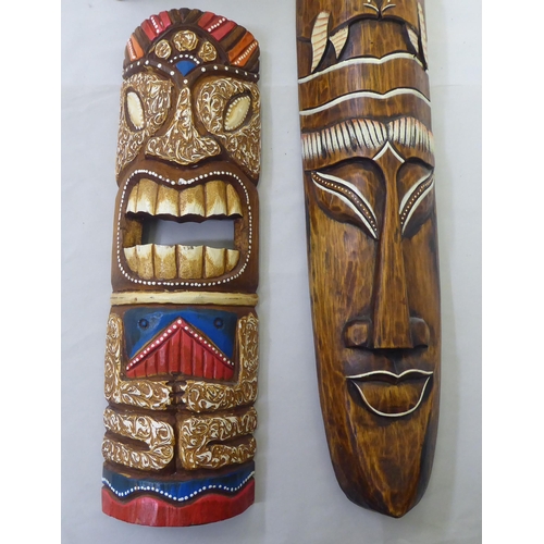 155 - Two modern painted wooden tribal inspired masks  39