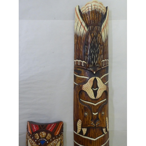 155 - Two modern painted wooden tribal inspired masks  39