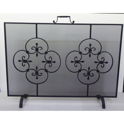 165 - Two similar modern black painted wrought iron framed mesh panelled, freestanding spark guards  26