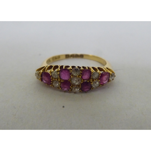 176 - An 18ct gold, diamond and ruby set cluster ring