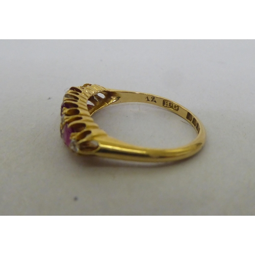 176 - An 18ct gold, diamond and ruby set cluster ring