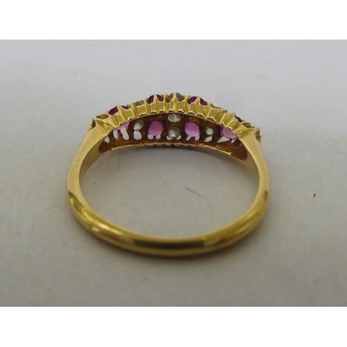 176 - An 18ct gold, diamond and ruby set cluster ring