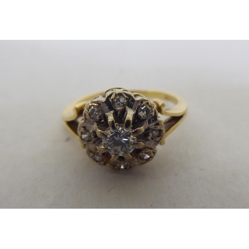 178 - A two tier diamond cluster ring  (broken shank stamped 18ct)