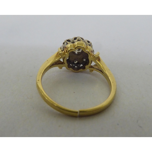 178 - A two tier diamond cluster ring  (broken shank stamped 18ct)