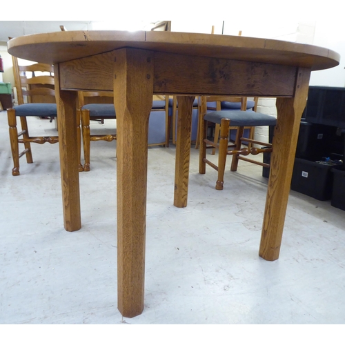 18 - A modern oak table, raised on block legs  30