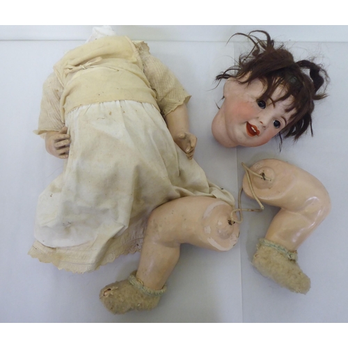 180 - An early/mid 20thC SFBJ of Paris bisque head doll, model no.236, on a composition body and mobile li... 