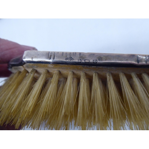 183 - Two silver backed dressing table hair brushes  mixed marks