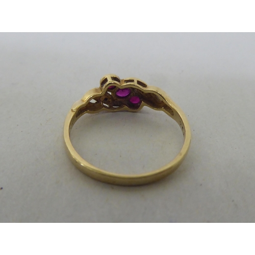 186 - A 9ct gold, ruby and diamond ring