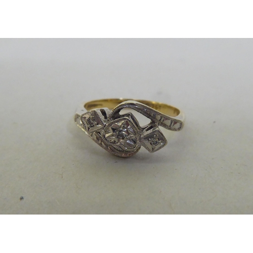 188 - An 18ct gold and platinum free-flowing, heart shaped and other diamond set ring