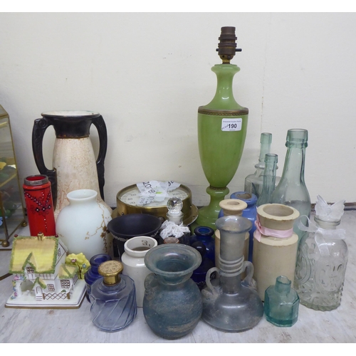 190 - A mixed lot of antique and later ceramics and glassware, mainly bottles and jars  tallest 6