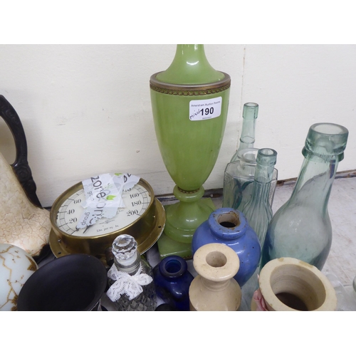 190 - A mixed lot of antique and later ceramics and glassware, mainly bottles and jars  tallest 6