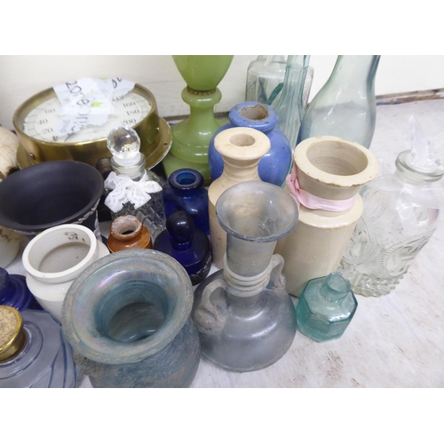 190 - A mixed lot of antique and later ceramics and glassware, mainly bottles and jars  tallest 6