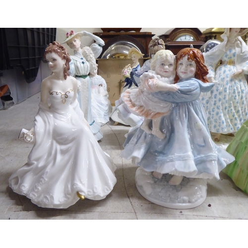 197 - Decorative ceramic figures: to include a Royal Worcester bone china example 'Safe at Last'  Limited ... 