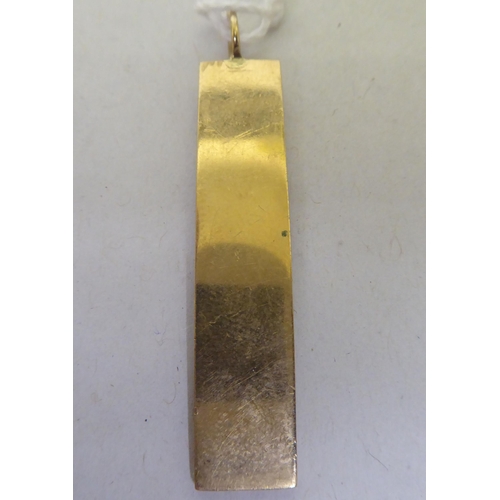 198 - A 9ct gold ingot pendant