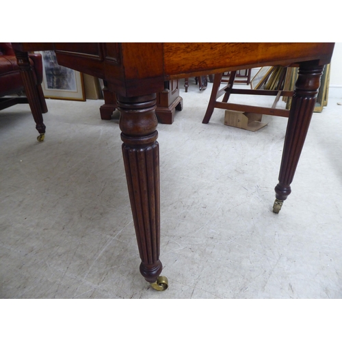 200 - A late Victorian mahogany kneehole five drawer writing table with a low part gallery border, raised ... 