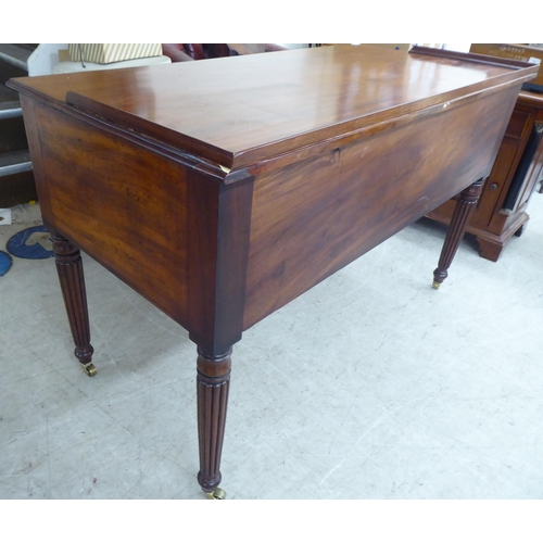 200 - A late Victorian mahogany kneehole five drawer writing table with a low part gallery border, raised ... 