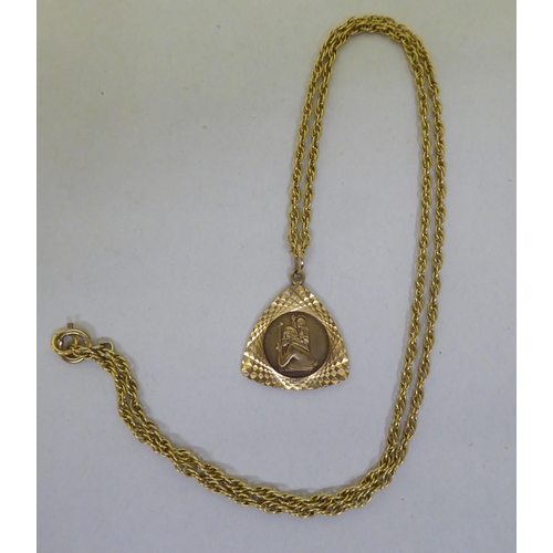 204 - A 9ct gold triangular pendant, on a fine neckchain