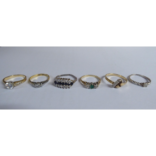 206 - Six white and gold rings, set with various stones